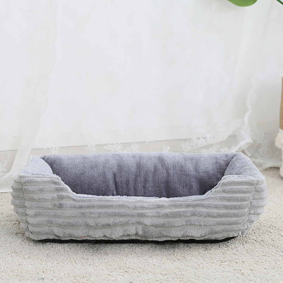 Dog Bed: Cozy up your furry friend with our Plush Kennel and Sofa Bed Cushion!